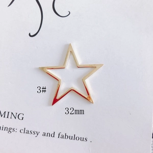 Detail of 32mm hollow gold star jewelry pendant for DIY earring accessories