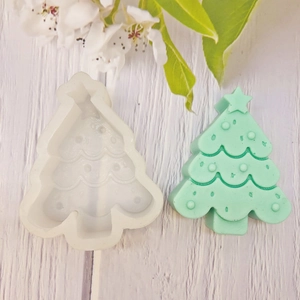Silicone mold for Christmas tree shaped candles with finished green resin ornament