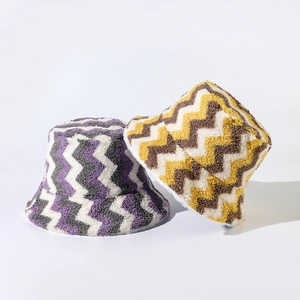 Plush wavy pattern bucket hats in purple and yellow colors for autumn and winter warmth