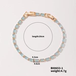 Detail showing 20cm gold chain with light blue rectangular crystal stones and dimensions