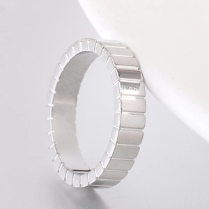 Detailed macro view of 4mm silver geometric square faceted ice cube stainless steel ring