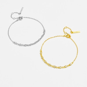 Detail of silver and gold S925 sterling silver bracelets with cubic zirconia stones