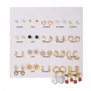15-pair set of gold geometric earrings with pearls, rhinestones and cherry pendants