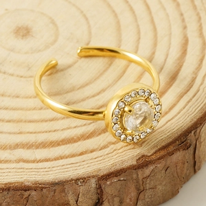 Double layer 18K gold plated stainless steel ring with zircon accents on wood background