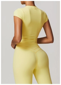 Detailed back view of light yellow slim fit sports t-shirt and high waist yoga leggings