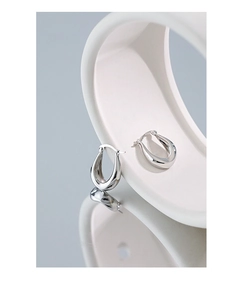 Close-up of S925 sterling silver U-shaped hoop earrings with polished mirror finish