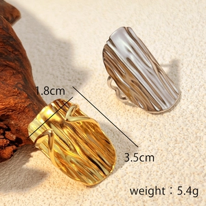 Artistic gold and silver stainless steel rings with organic bark texture and open design