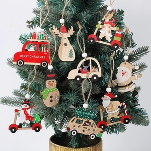 Hanging wooden Christmas tree ornaments featuring Santa, snowman and reindeer motifs