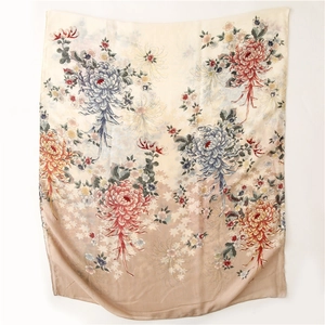 Detailed view of vintage floral print on beige linen-feel scarf with rolled edges