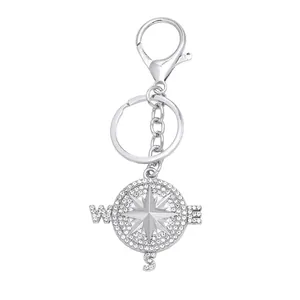 Silver compass keychain with sparkling rhinestones and an eight-pointed star charm