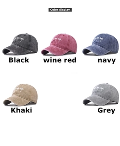 Detailed display of washed cotton baseball caps with palm tree embroidery in five colors