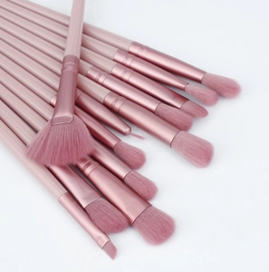 Detail view of 12-piece pink eye makeup brush set with rose gold ferrules and soft bristles