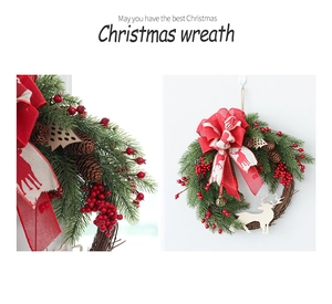 Detail of Christmas wreath with pine cones, red berries and reindeer bow ornaments