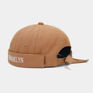 Detail of Brooklyn embroidery on brown canvas docker hat with vintage rolled edge finish
