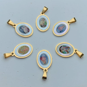 Golden stainless steel Guadalupe pendants with religious mother of pearl oval designs