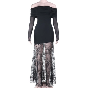 Detail showing the elegant black lace patchwork on the hem of the off-shoulder dress
