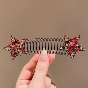 Macro shot of wave hair comb with multi-color rhinestone stars for elegant hair styling