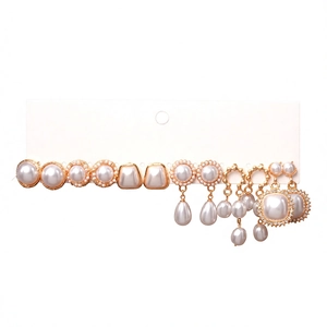 Set of 6 pairs vintage gold earrings with faux pearls and rhinestones on white card