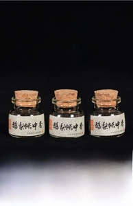 Macro shot of traditional handmade scented pills in glass jars with cork stoppers