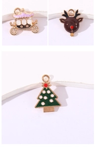 Detailed view of enamel Christmas charms including pumpkin carriage, reindeer, and tree