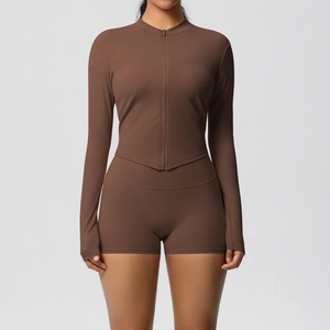 Detail view of brown two-piece yoga set with zip jacket and high-waist shorts