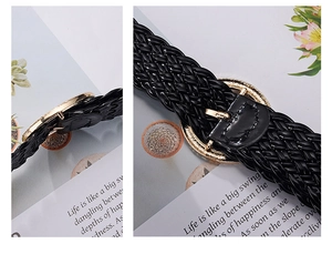 Close-up of black woven belt with a round golden metal buckle for women's dresses