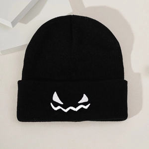 Classic black knitted pumpkin expression beanie for Halloween casual winter wear
