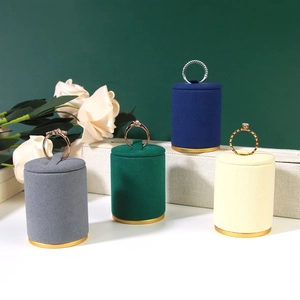 Velvet jewelry display stands in multiple colors with gold metal bases and rings