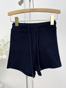 Detailed view of high waist navy blue gym shorts featuring adjustable drawstring waist