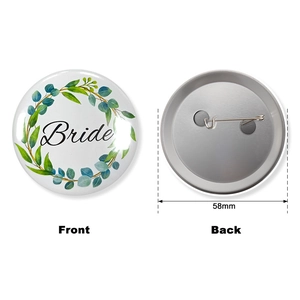 Macro detail of 58mm Team Bride badge featuring a green wreath and metal pin back