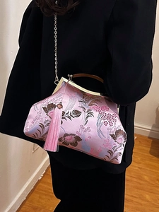 Pink silk embroidery handbag with floral patterns, wooden handle, and a tassel detail