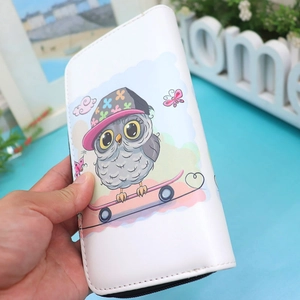 Close-up of white PU leather wallet featuring a colorful cartoon owl on skateboard print