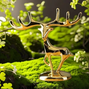Polished golden deer figurine detail featuring branching antlers for jewelry display