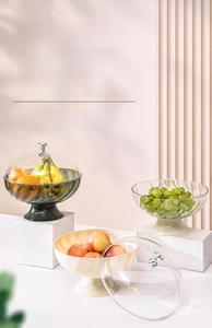 Detail of luxury fruit trays with silver bear lids in green, white and clear textures