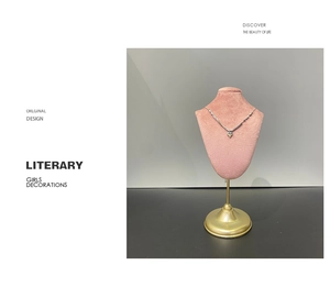 Silver heart pendant necklace showcased on a premium pink velvet bust display stand