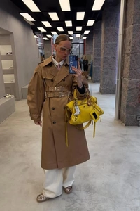 Classic khaki double-breasted trench coat for women with stylish dual waist belts detail