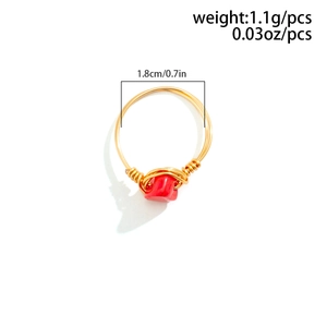 Detailed view of handmade gold wire ring with red raw stone inlay and size dimensions
