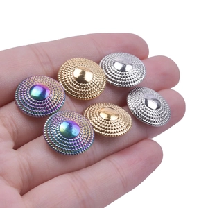 Detail of colorful 304 stainless steel geometric earrings with textured bead edges