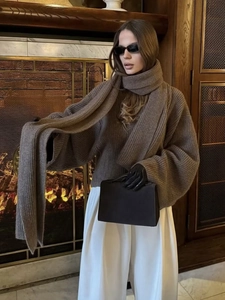 Coffee brown loose knit sweater with matching long scarf for a cozy winter style