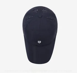 Detailed top view of navy quick-dry sports cap featuring laser-cut ventilation holes
