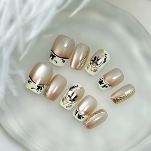 Handmade press-on nails with elegant bamboo leaf design and cat-eye French style finish