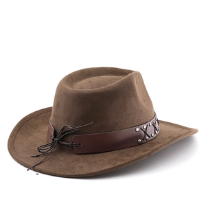 Detail of brown fedora hat with leather band and metal rivets in vintage western style