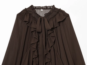 Detailed view of dark brown chiffon blouse featuring tiered ruffles and a tie-up neckline