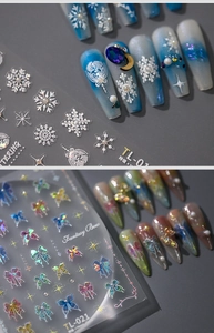 Macrodetail van 5D 3D reliëf nagelstickers met sneeuwvlokken en holografische strikken