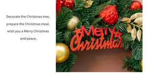 Macro shot of 50cm Christmas wreath with red and gold ornaments and Merry Christmas sign