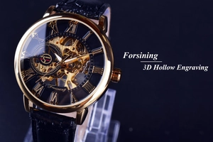 Detail of golden mechanical watch with 3D hollow engraving and black leather strap