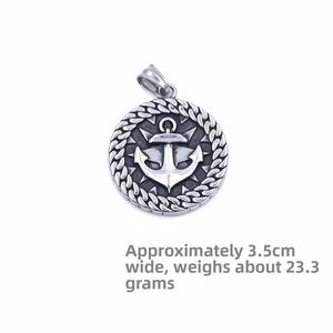 Detail of vintage steel nautical anchor pendant with compass star and rope edge