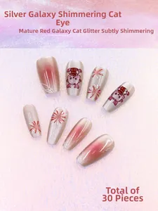 Detail view of cat eye press-on nails in silver galaxy and festive red with 30 pieces