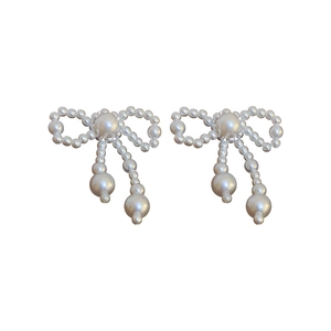 Elegant bow-shaped pearl tassel stud earrings with minimalist white background