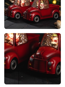 Detail view of red vintage truck Christmas snow globe with glowing light and snowman